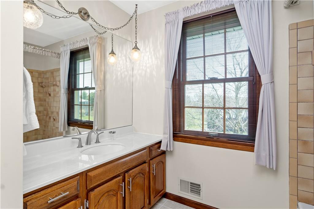 313 Knobs Hill Court Wexford, PA 15090 - Photo 18 of 25 a bathroom with a sink and a window