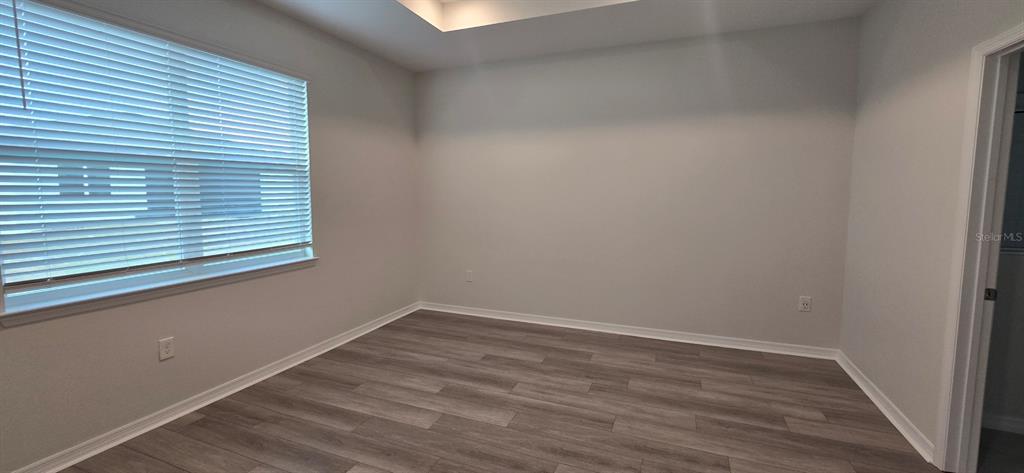 7193 Southwest 64th St Road Ocala, FL 34474 - Photo 11 of 17 a view of a small space with wooden floor and a window