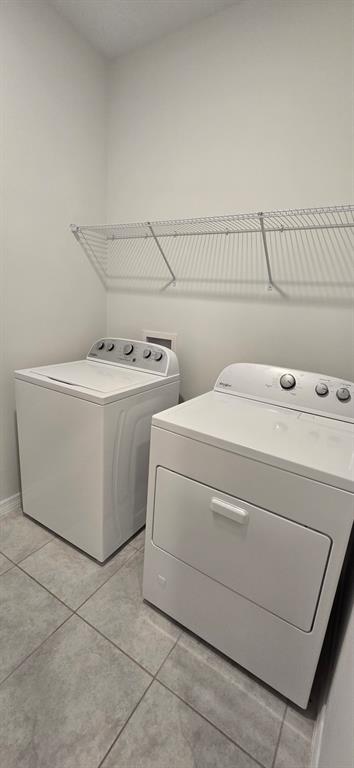 7193 Southwest 64th St Road Ocala, FL 34474 - Photo 16 of 17 a utility room with dryer and washer