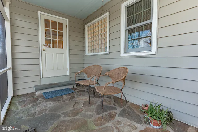 a backyard of a house with seating space