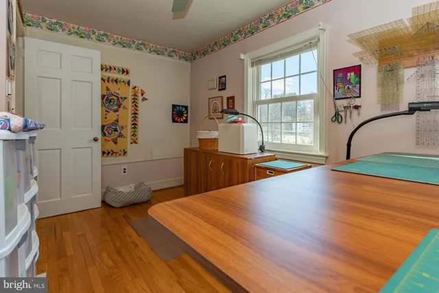 a bed room with a bed and a view of living room