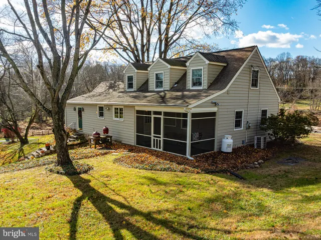 a view of a house with snow on the background