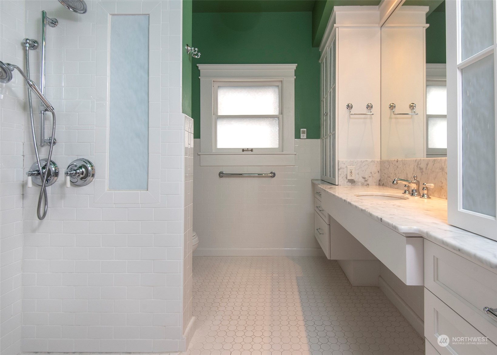 2208 Rucker Avenue Everett, WA 98201 - Photo 19 of 29 a bathroom with a granite countertop sink a mirror and a bathtub