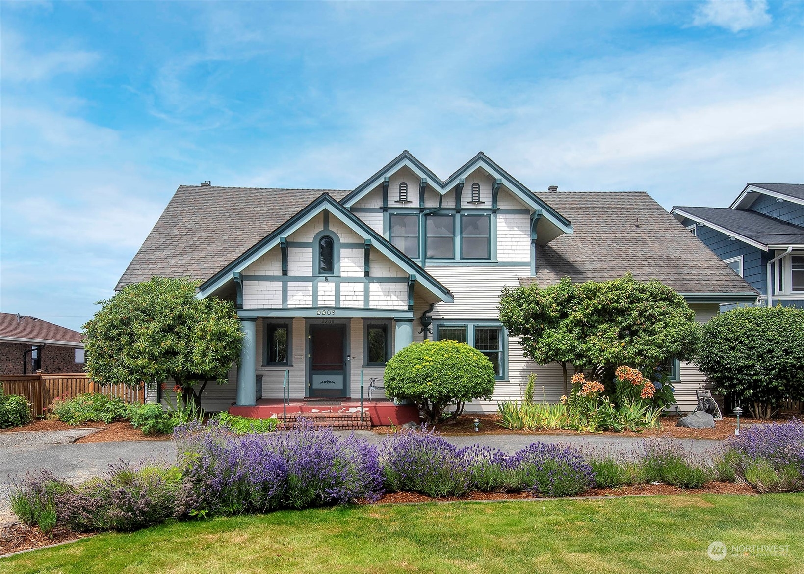 2208 Rucker Avenue Everett, WA 98201 - Photo 2 of 29 a front view of a house with a yard and garage