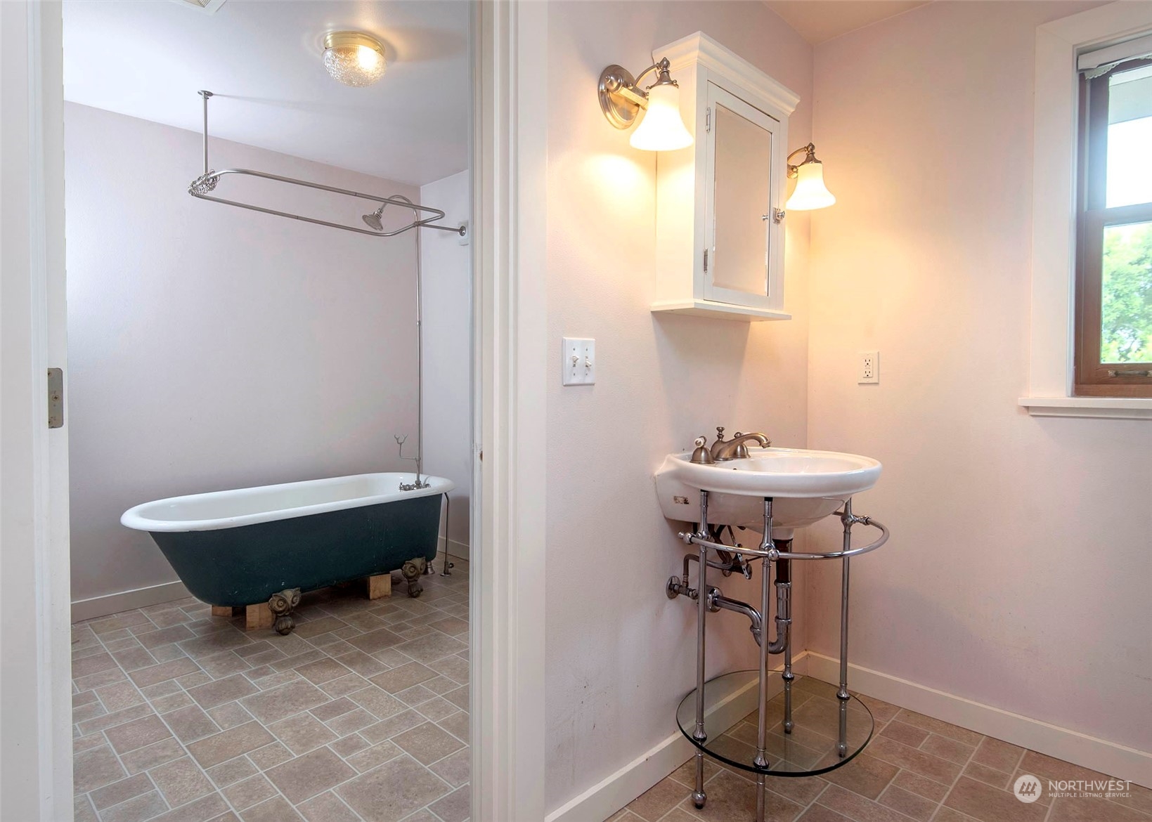 2208 Rucker Avenue Everett, WA 98201 - Photo 21 of 29 a bathroom with a sink a toilet and shower