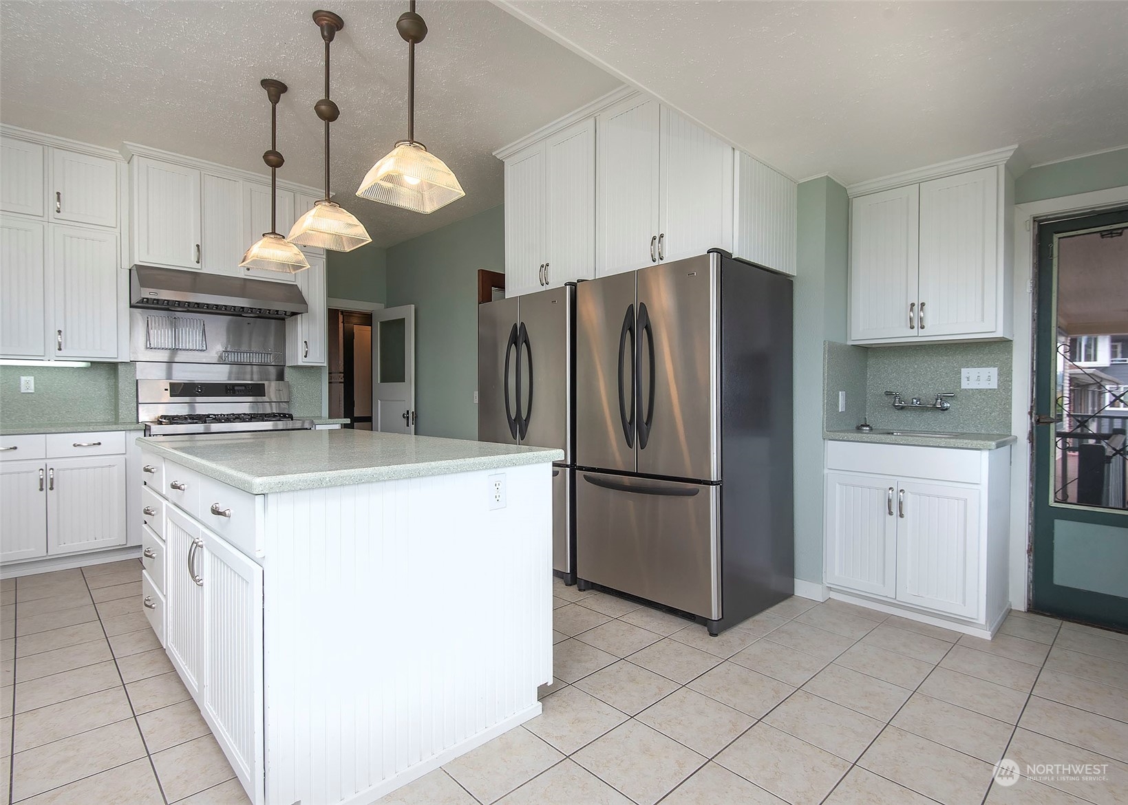 2208 Rucker Avenue Everett, WA 98201 - Photo 24 of 29 a kitchen with a refrigerator a sink and dishwasher