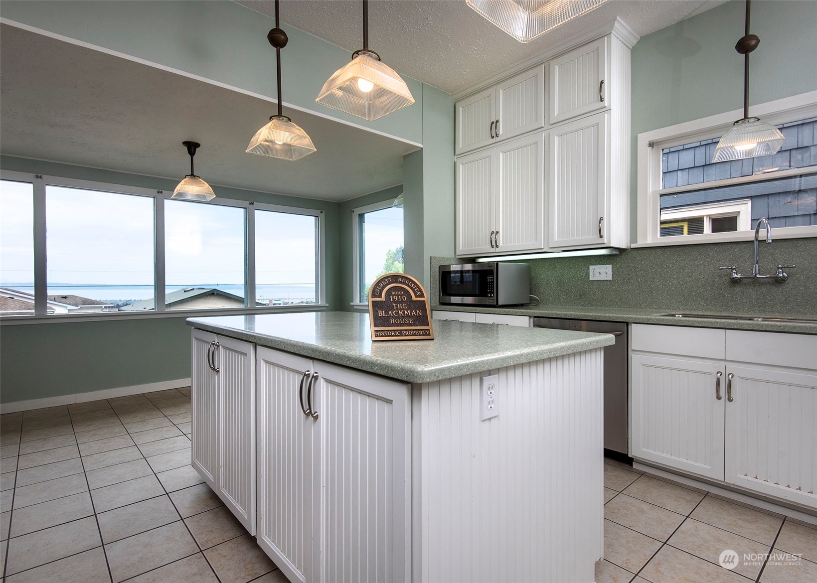 2208 Rucker Avenue Everett, WA 98201 - Photo 25 of 29 a kitchen with stainless steel appliances granite countertop a sink and a stove