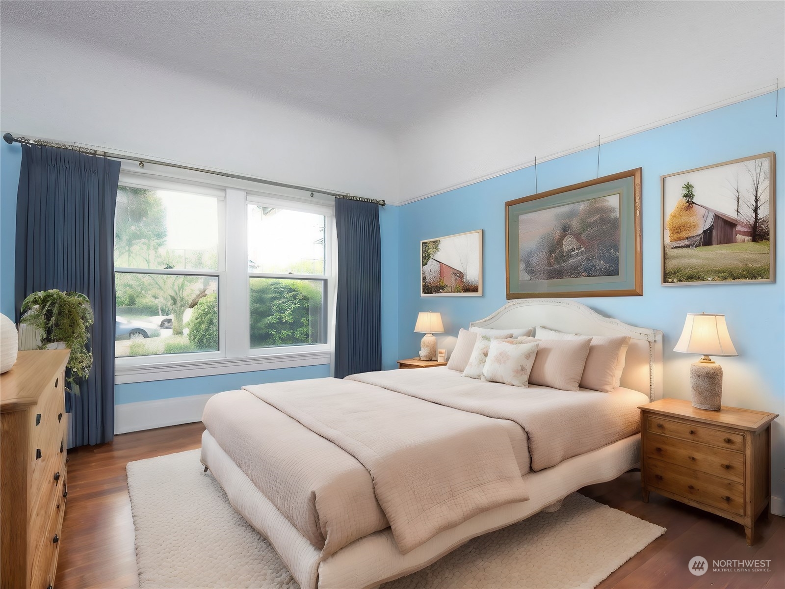 2208 Rucker Avenue Everett, WA 98201 - Photo 7 of 29 a bedroom with a large bed and a window