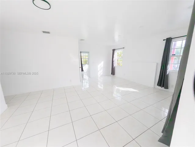 a view of an empty room and window