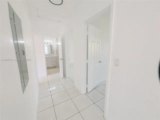 a bathroom with a shower and a mirror