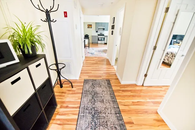 a view of entryway with wooden floor
