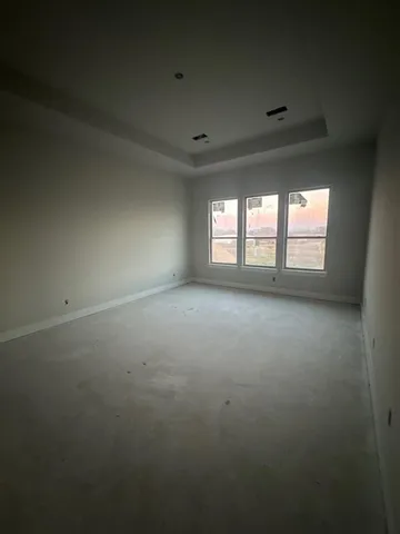 wooden floor and window in an empty room