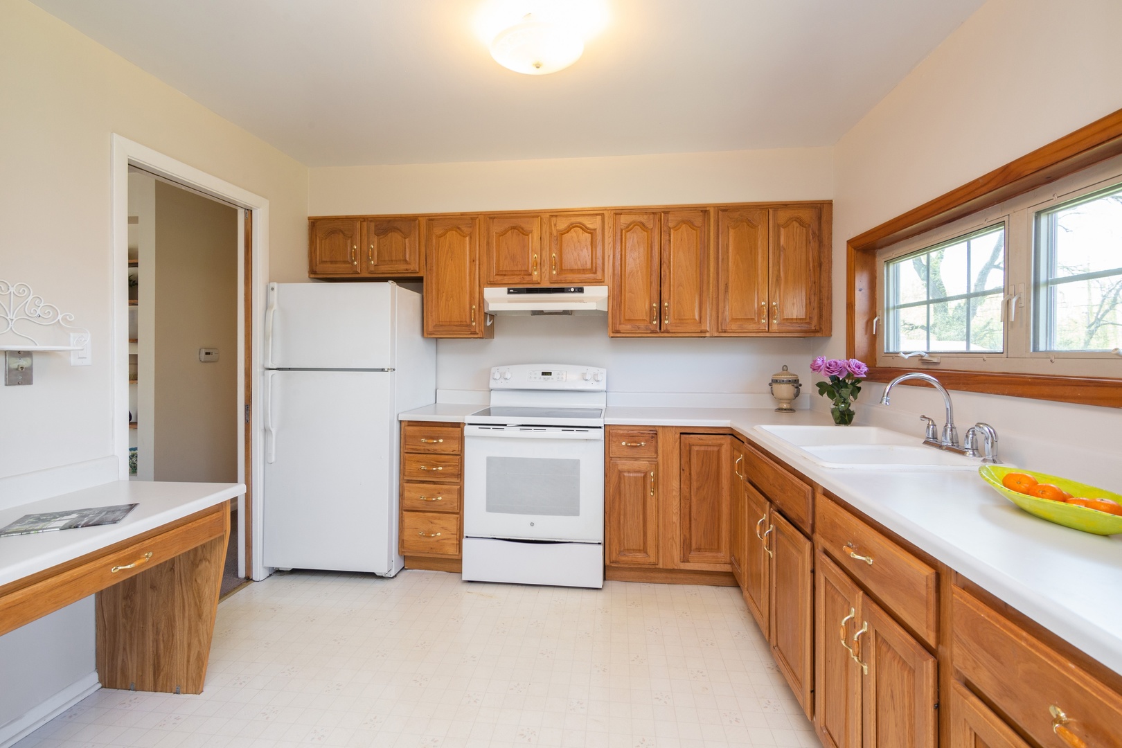 812 Meadow Road Northbrook, IL 60062 - Photo 3 of 10 a kitchen with a sink stove and refrigerator