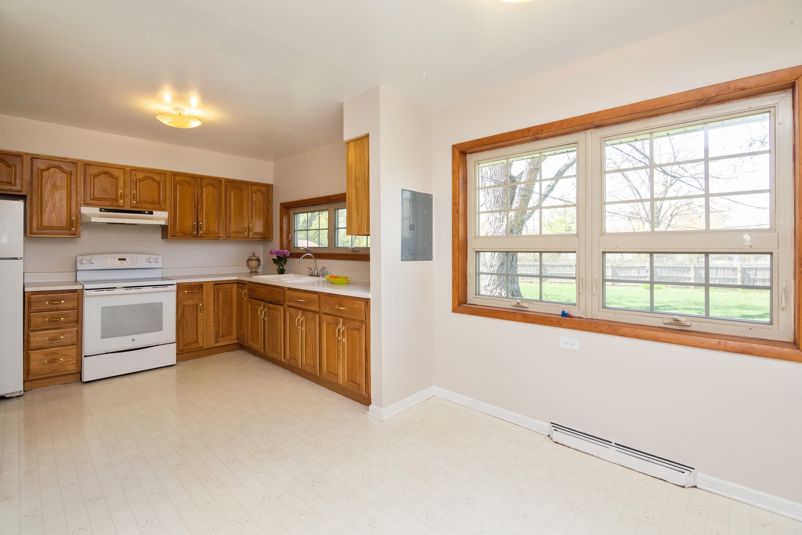 812 Meadow Road Northbrook, IL 60062 - Photo 4 of 10 a kitchen with stainless steel appliances a stove a sink and a refrigerator