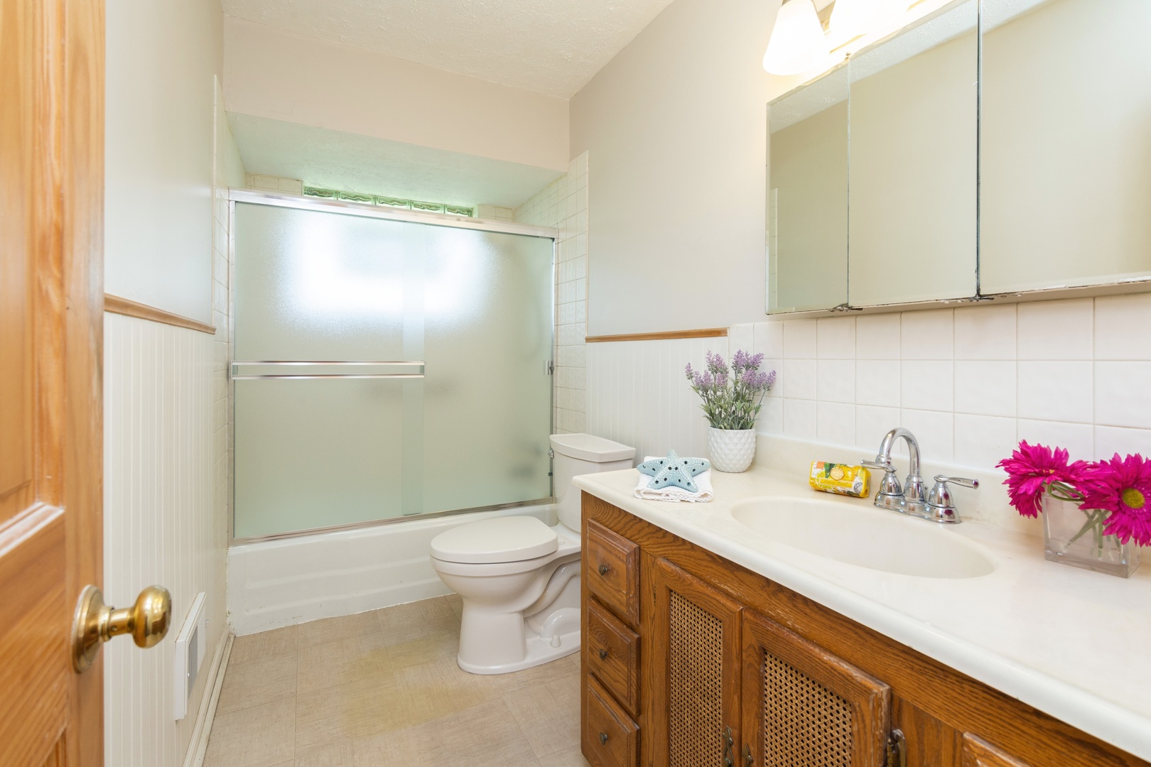 812 Meadow Road Northbrook, IL 60062 - Photo 7 of 10 a bathroom with a granite countertop sink a toilet and a shower