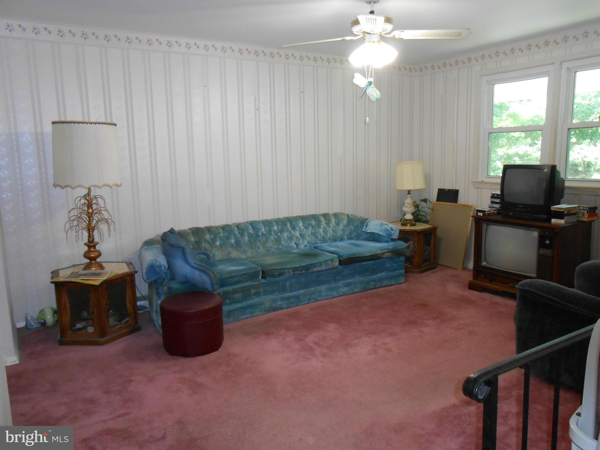 1310 Jewell Road Dunkirk, MD 20754 - Photo 3 of 9 a living room with furniture and a chandelier