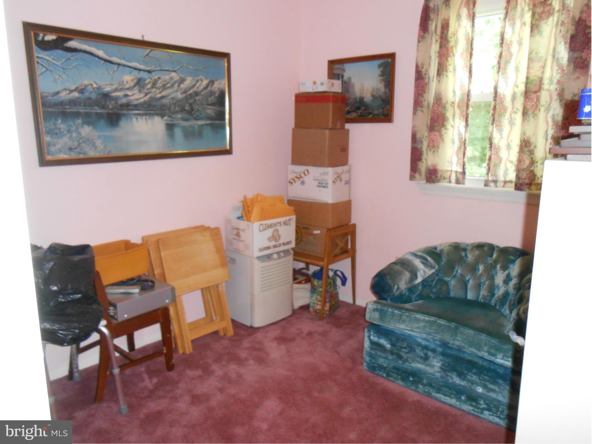 1310 Jewell Road Dunkirk, MD 20754 - Photo 5 of 9 a living room with furniture and a painting on the wall