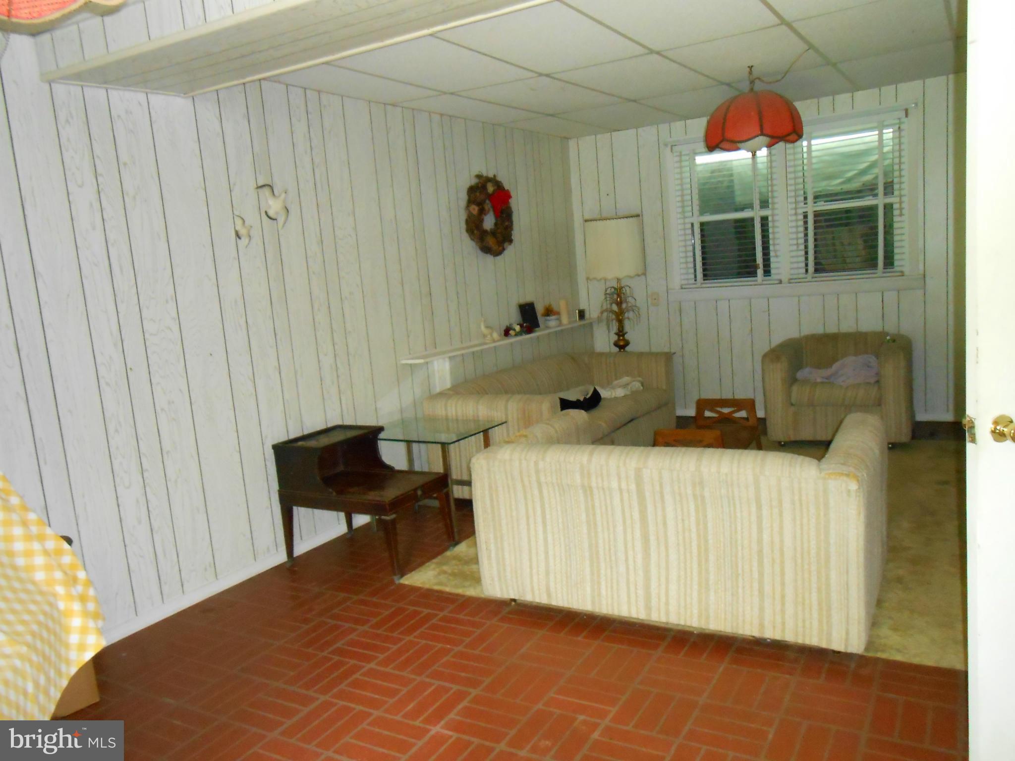 1310 Jewell Road Dunkirk, MD 20754 - Photo 7 of 9 a bedroom with a bed and a chair