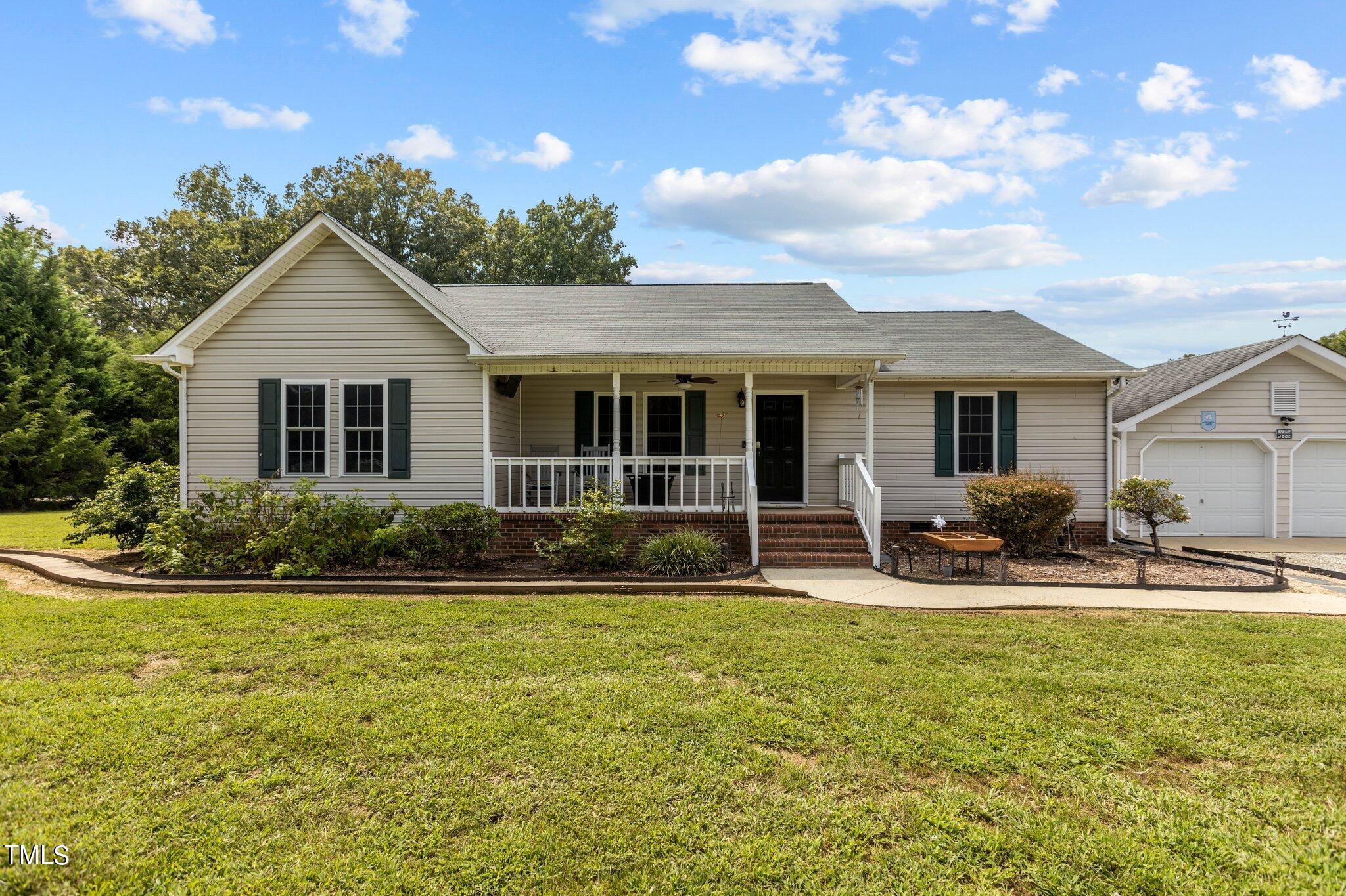 810 Willie Gray Road Timberlake, NC 27583 - Photo 1 of 28 a house view with swimming pool and garden
