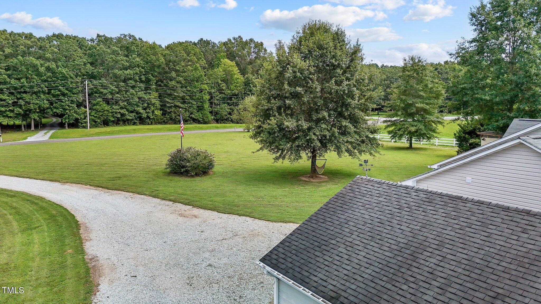 810 Willie Gray Road Timberlake, NC 27583 - Photo 24 of 28 a view of a backyard with a garden