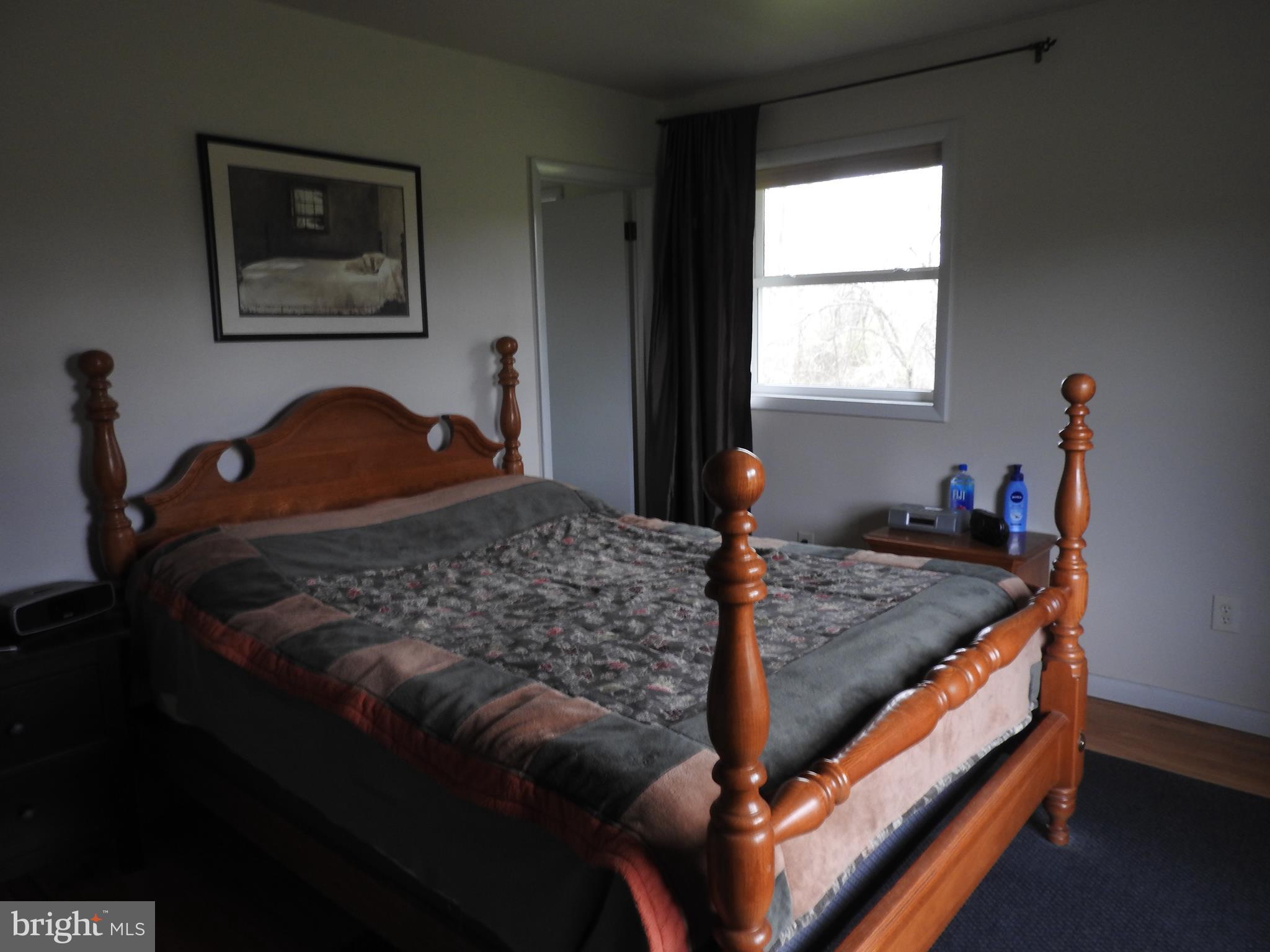 2711 Bel Pre Road Silver Spring, MD 20906 - Photo 12 of 19 a bedroom with a bed and a window