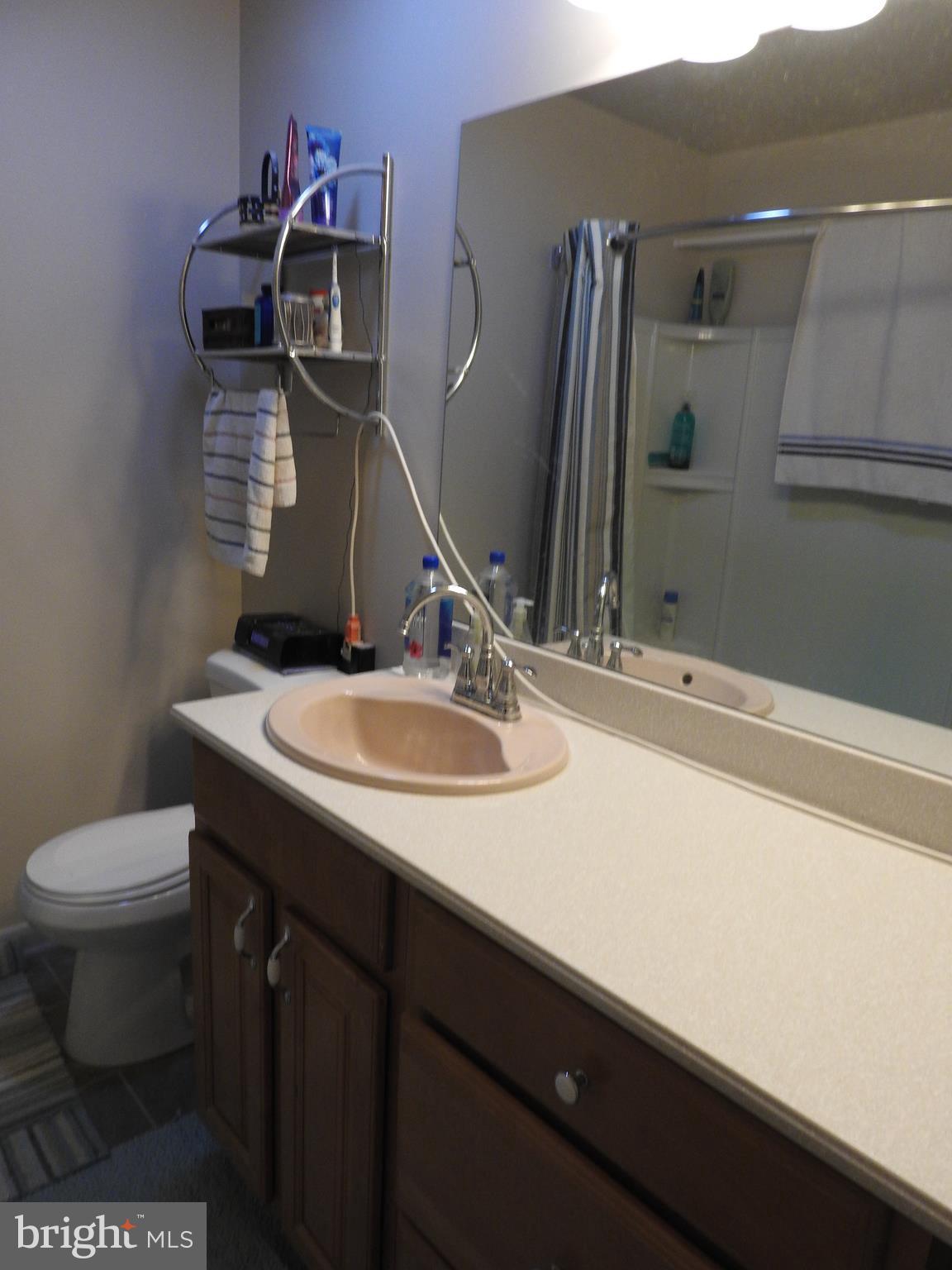 2711 Bel Pre Road Silver Spring, MD 20906 - Photo 13 of 19 a bathroom with a sink and a toilet
