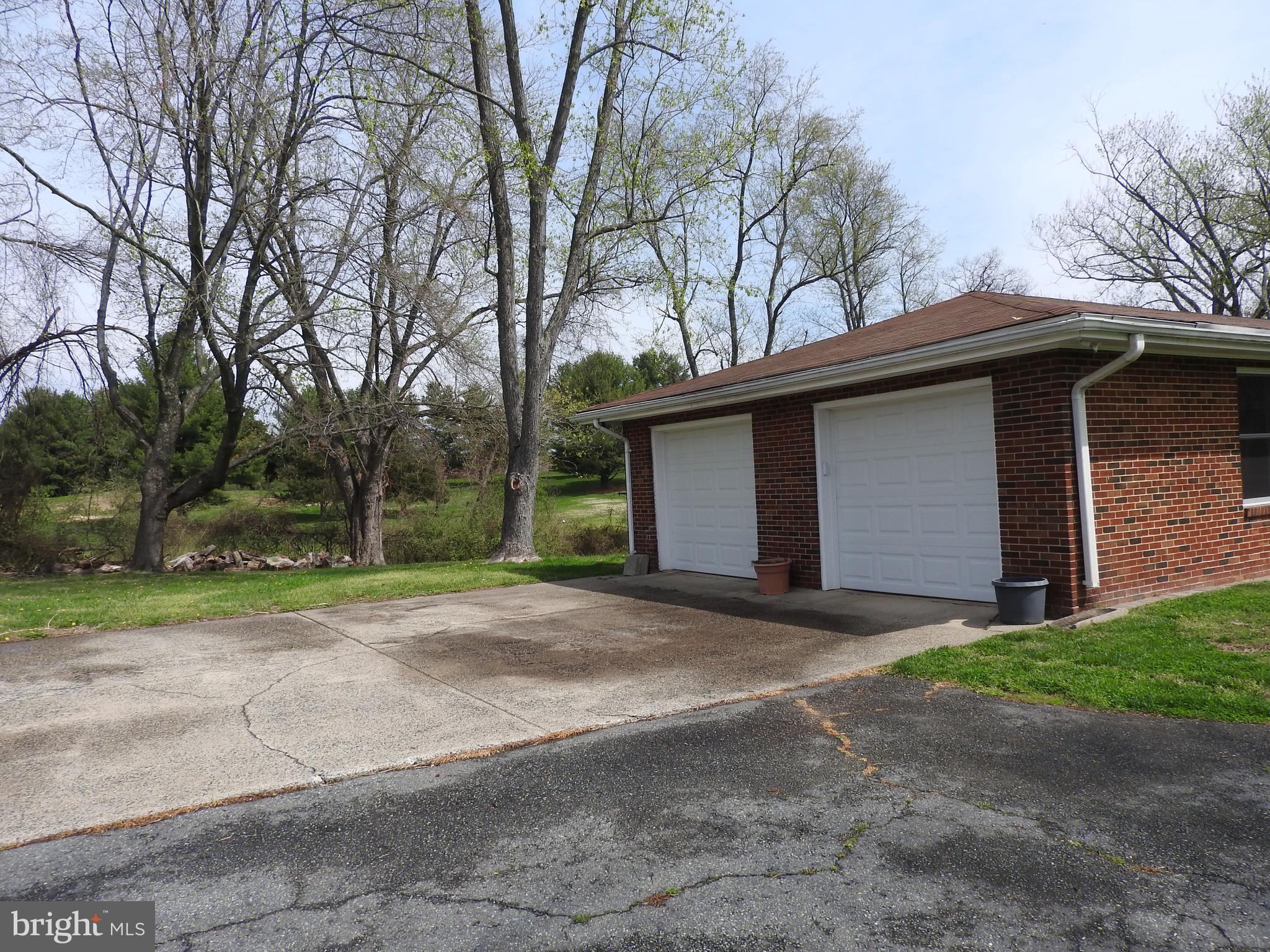 2711 Bel Pre Road Silver Spring, MD 20906 - Photo 2 of 19 a front view of a house with a yard and garage