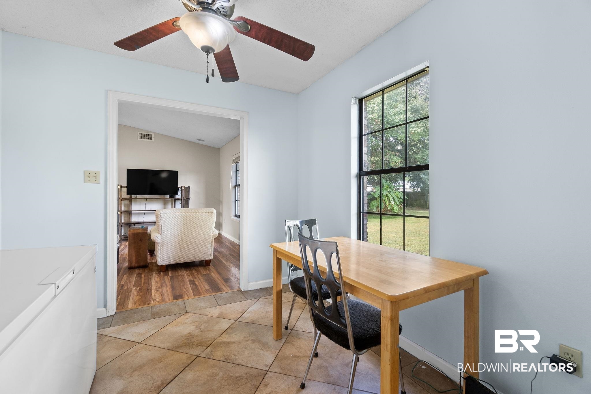 33135 Collier Road Lillian, AL 36549 - Photo 9 of 30 Dining space featuring light tile patterned floors and a ceiling fan