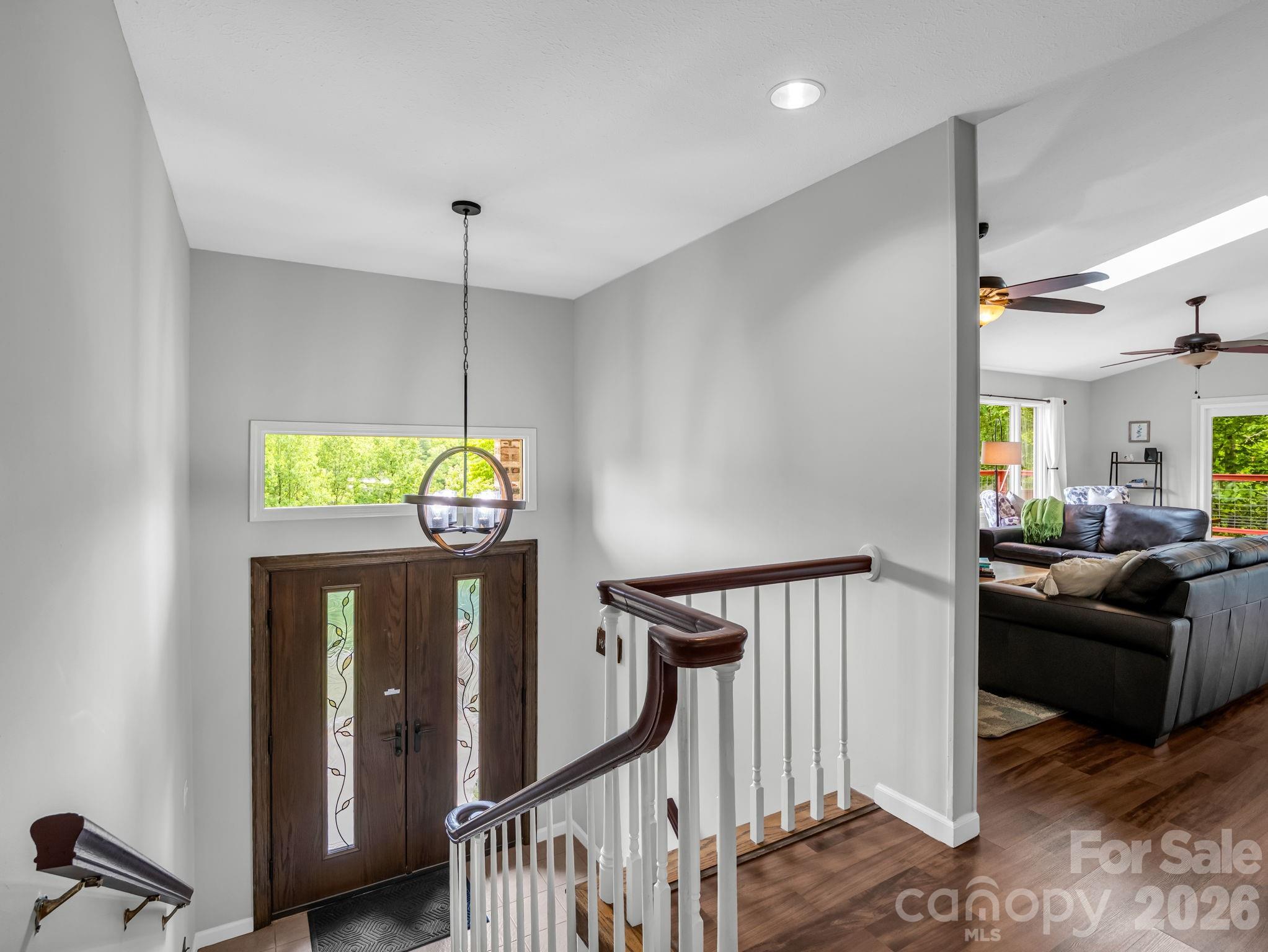 656 Cashiers Valley Road Brevard, NC 28712 - Photo 4 of 37 a view of a livingroom with furniture and windows