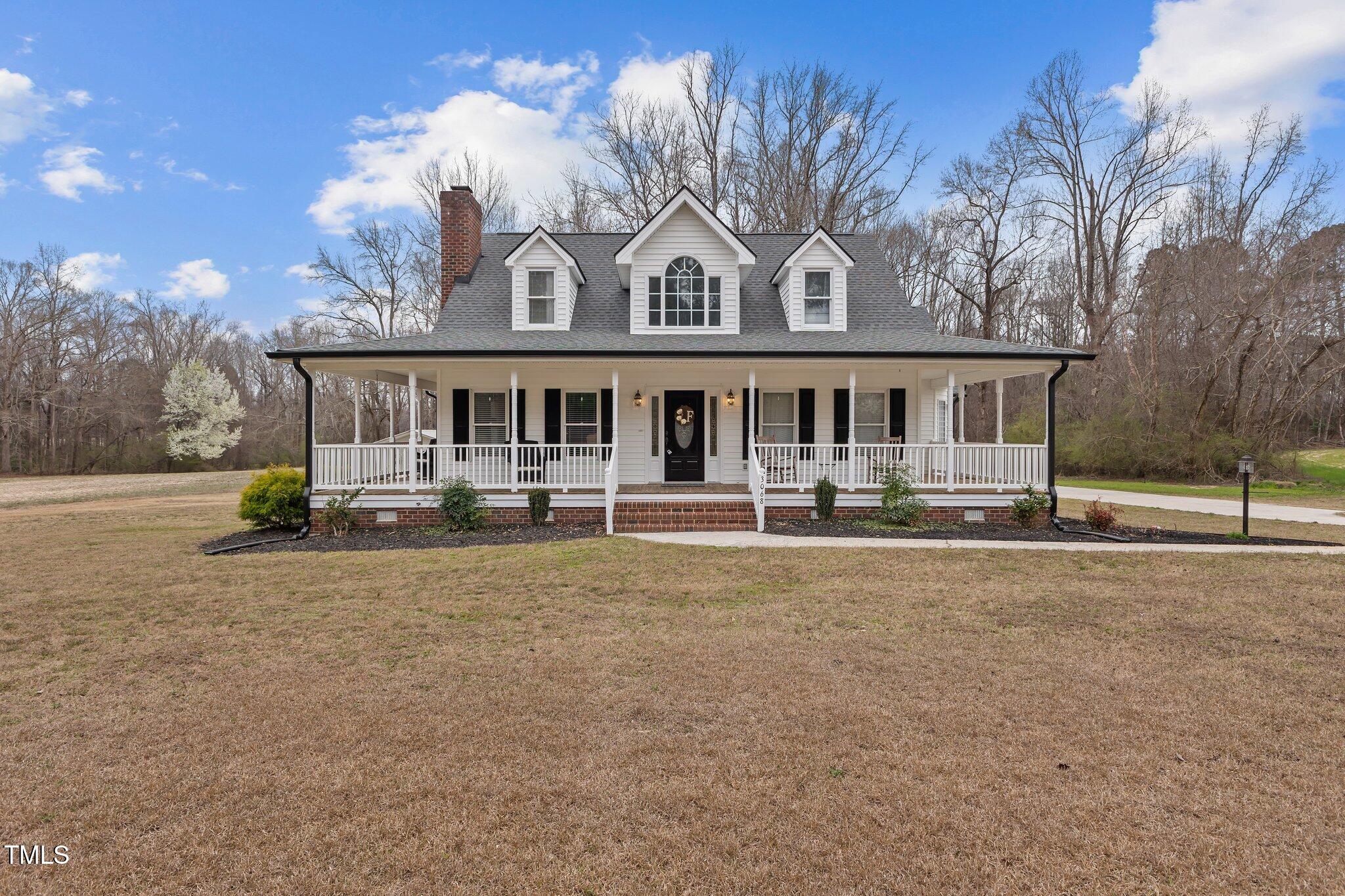 3068 Benson Road Angier, NC 27501 - Photo 1 of 52 front view of a house with a small yard