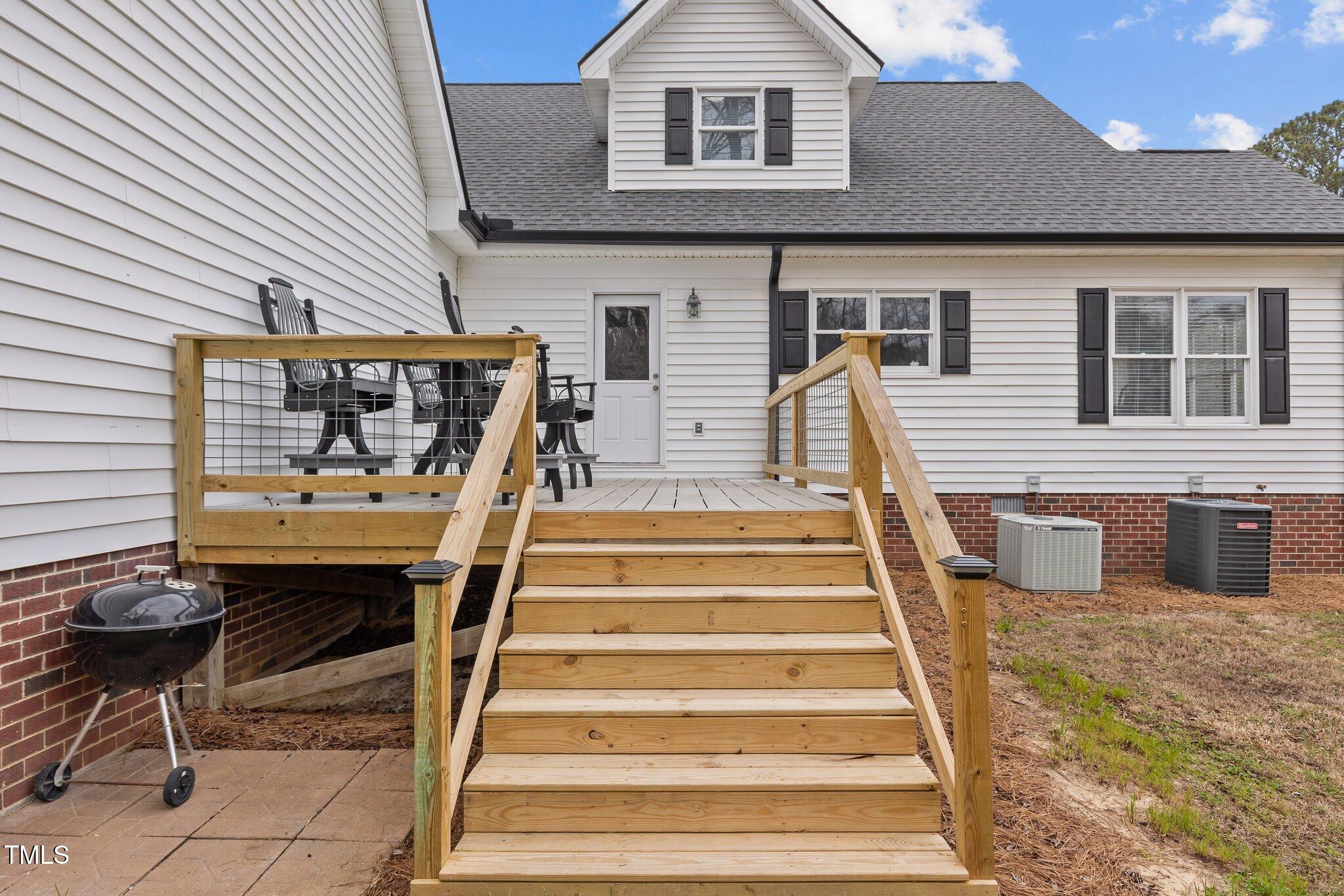 3068 Benson Road Angier, NC 27501 - Photo 42 of 52 a view of a patio with table and chairs