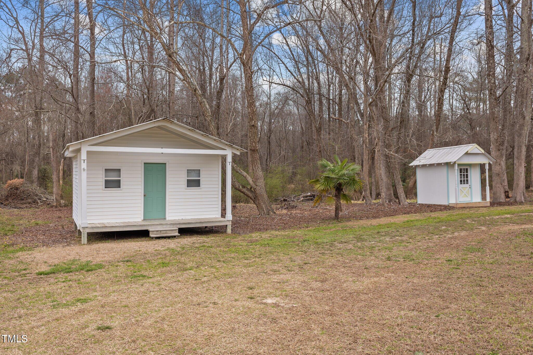3068 Benson Road Angier, NC 27501 - Photo 46 of 52 a front view of a house with a garden