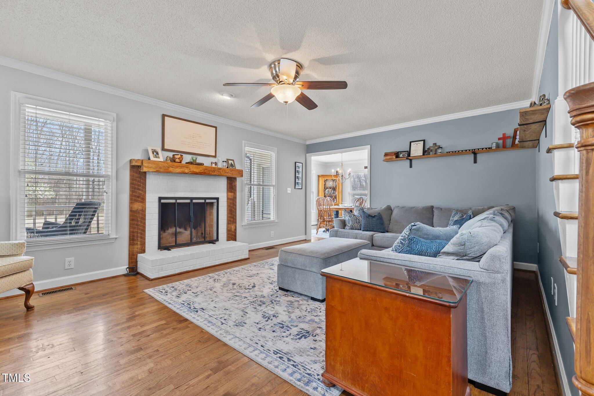 3068 Benson Road Angier, NC 27501 - Photo 8 of 52 a living room with furniture and a fireplace
