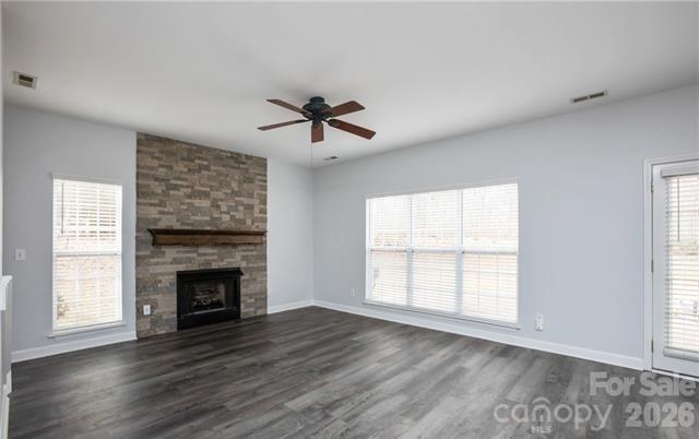 815 Knightsbridge Road Fort Mill, SC 29708 - Photo 15 of 30 an empty room with wooden floor fireplace and windows