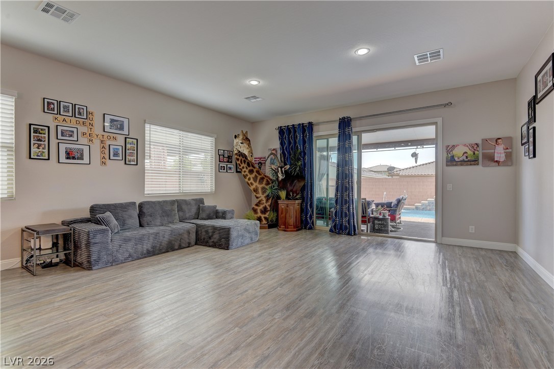 5967 Yellow Ridge Avenue Las Vegas, NV 89131 - Photo 10 of 33 This inviting living area boasts ample natural light and seamless indoor-outdoor living.
