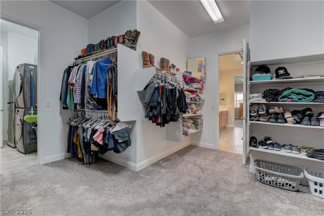 5967 Yellow Ridge Avenue Las Vegas, NV 89131 - Photo 17 of 33 This spacious walk-in closet offers ample storage and easy access to a convenient laundry area.
