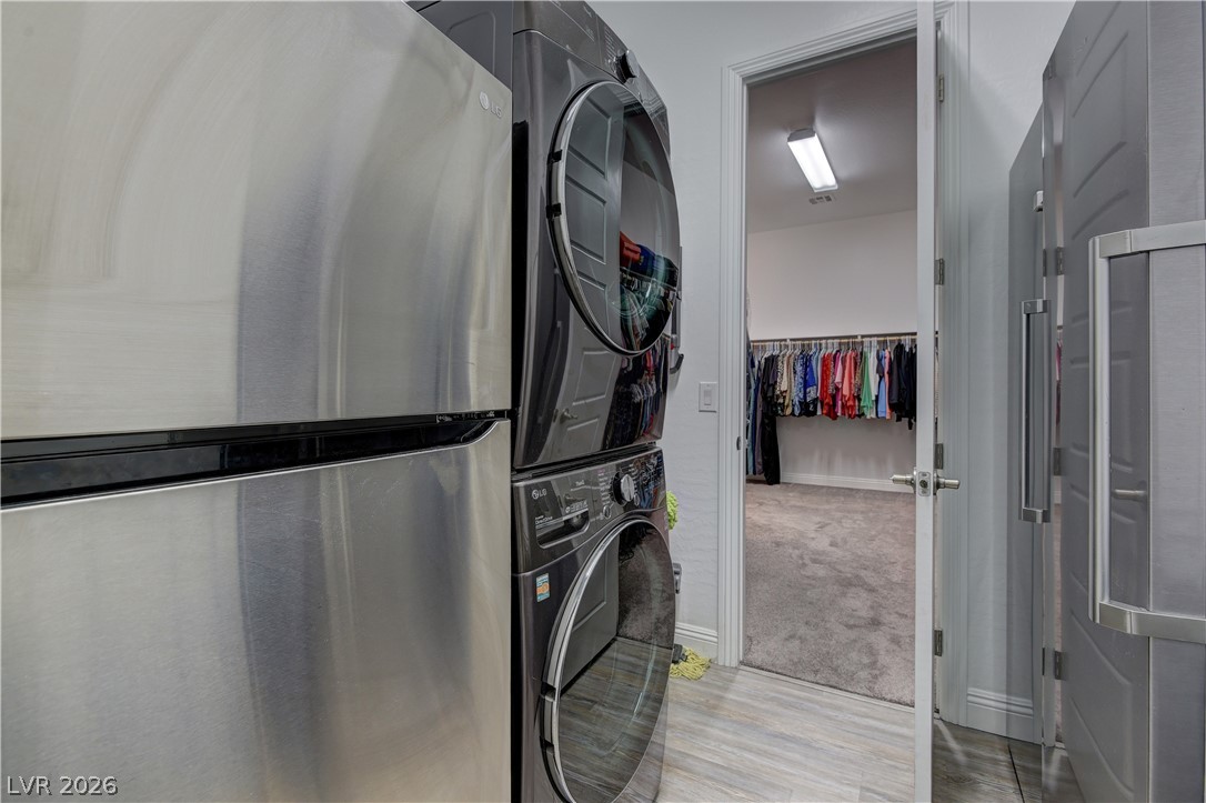 5967 Yellow Ridge Avenue Las Vegas, NV 89131 - Photo 19 of 33 This dedicated laundry area features modern appliances and convenient access to a spacious walk-in closet.
