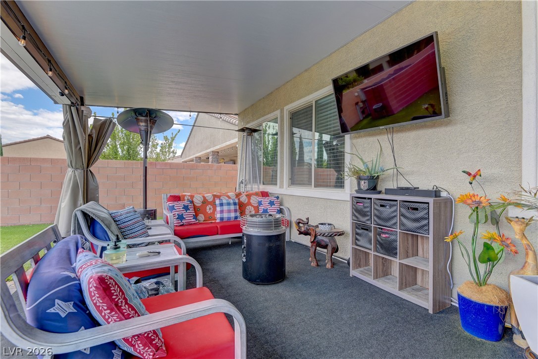 5967 Yellow Ridge Avenue Las Vegas, NV 89131 - Photo 28 of 33 An inviting outdoor patio, perfect for relaxing or entertaining, extends living space beautifully.