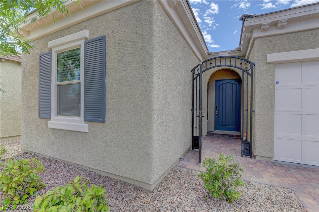 5967 Yellow Ridge Avenue Las Vegas, NV 89131 - Photo 3 of 33 This charming residence features an inviting entryway and classic exterior details.