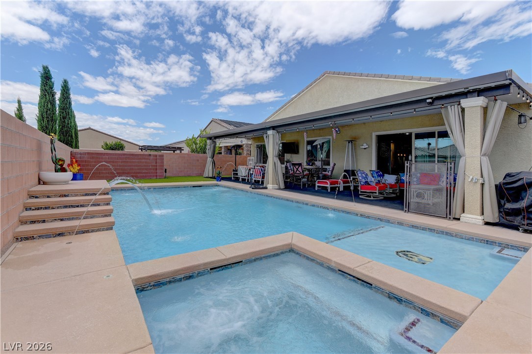 5967 Yellow Ridge Avenue Las Vegas, NV 89131 - Photo 30 of 33 This outdoor oasis offers a refreshing pool and spa, perfect for relaxation and entertaining.