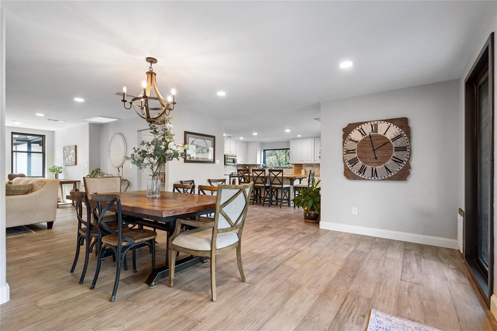 950 Naylor Road Cross Roads, TX 76227 - Photo 12 of 40 a view of a dining room with furniture and wooden floor
