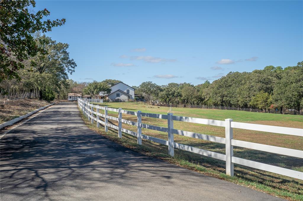 950 Naylor Road Cross Roads, TX 76227 - Photo 3 of 40 a view of a pathway with a wrought fence