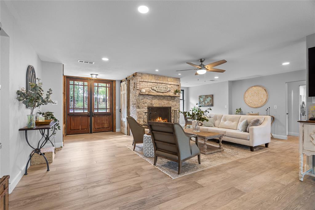 950 Naylor Road Cross Roads, TX 76227 - Photo 6 of 40 a living room with furniture and a fireplace