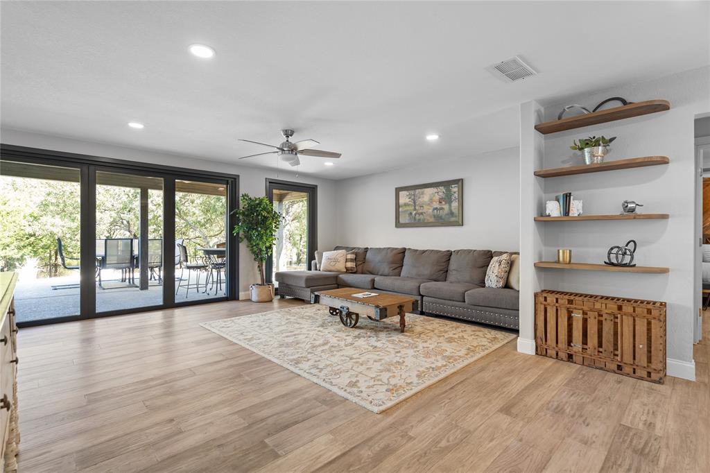 950 Naylor Road Cross Roads, TX 76227 - Photo 10 of 40 a living room with furniture and a large window