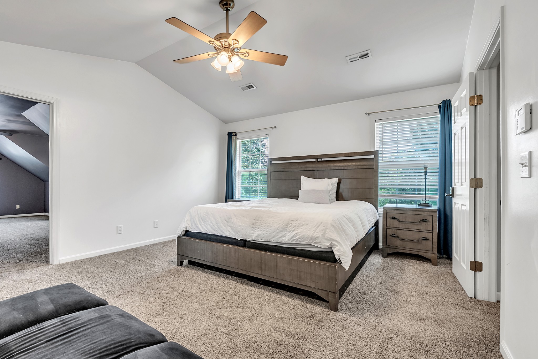 3848 Kedron Road Spring Hill, TN 37174 - Photo 14 of 33 a bedroom with a bed and a chandelier