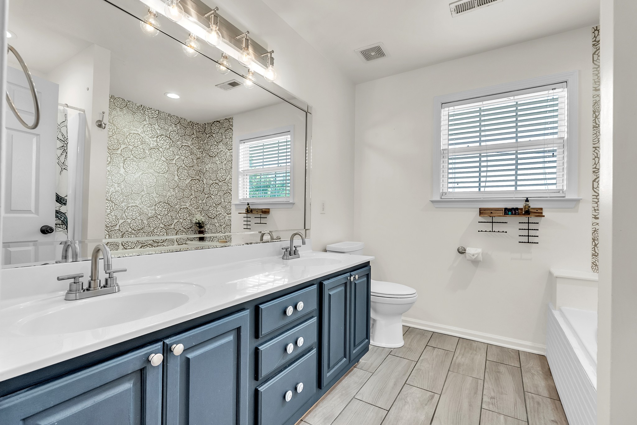 3848 Kedron Road Spring Hill, TN 37174 - Photo 16 of 33 a bathroom with a sink a toilet a large mirror and shower