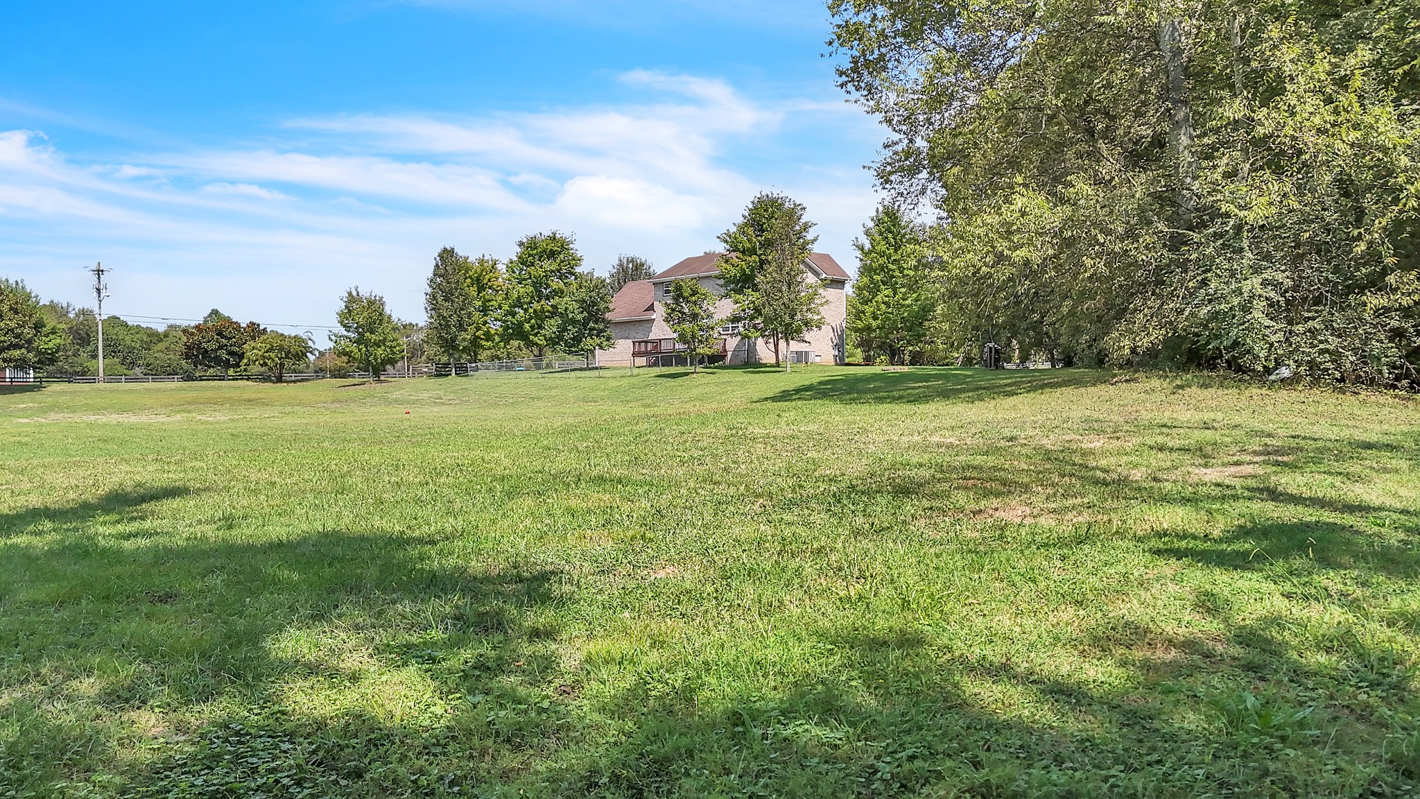 3848 Kedron Road Spring Hill, TN 37174 - Photo 32 of 33 a view of a field with trees in the background