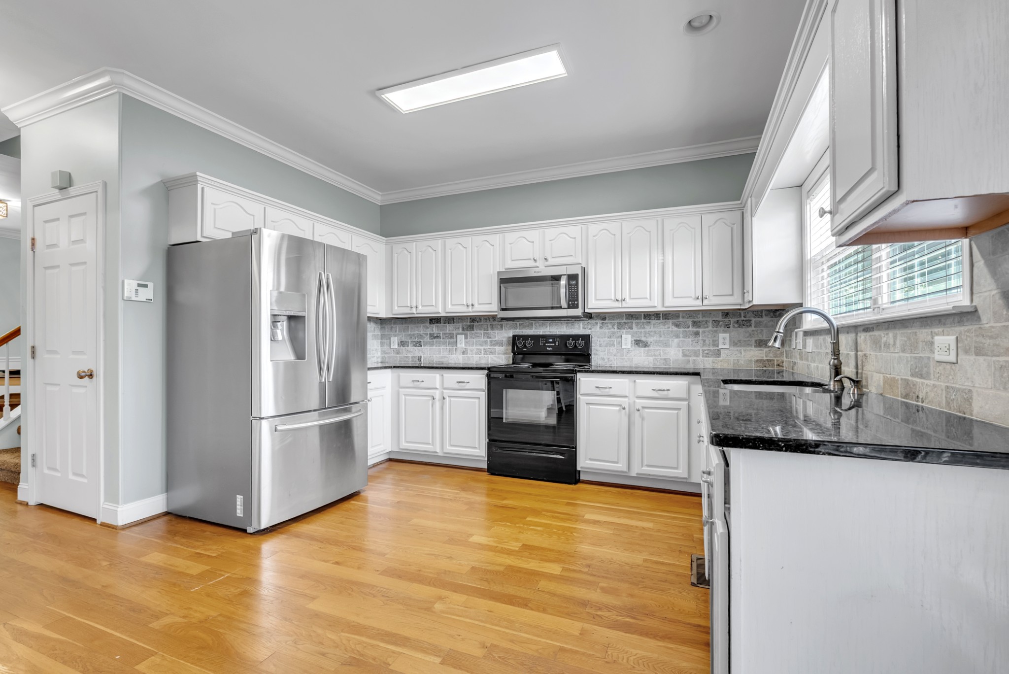 3848 Kedron Road Spring Hill, TN 37174 - Photo 8 of 33 a kitchen with stainless steel appliances granite countertop a refrigerator sink and microwave