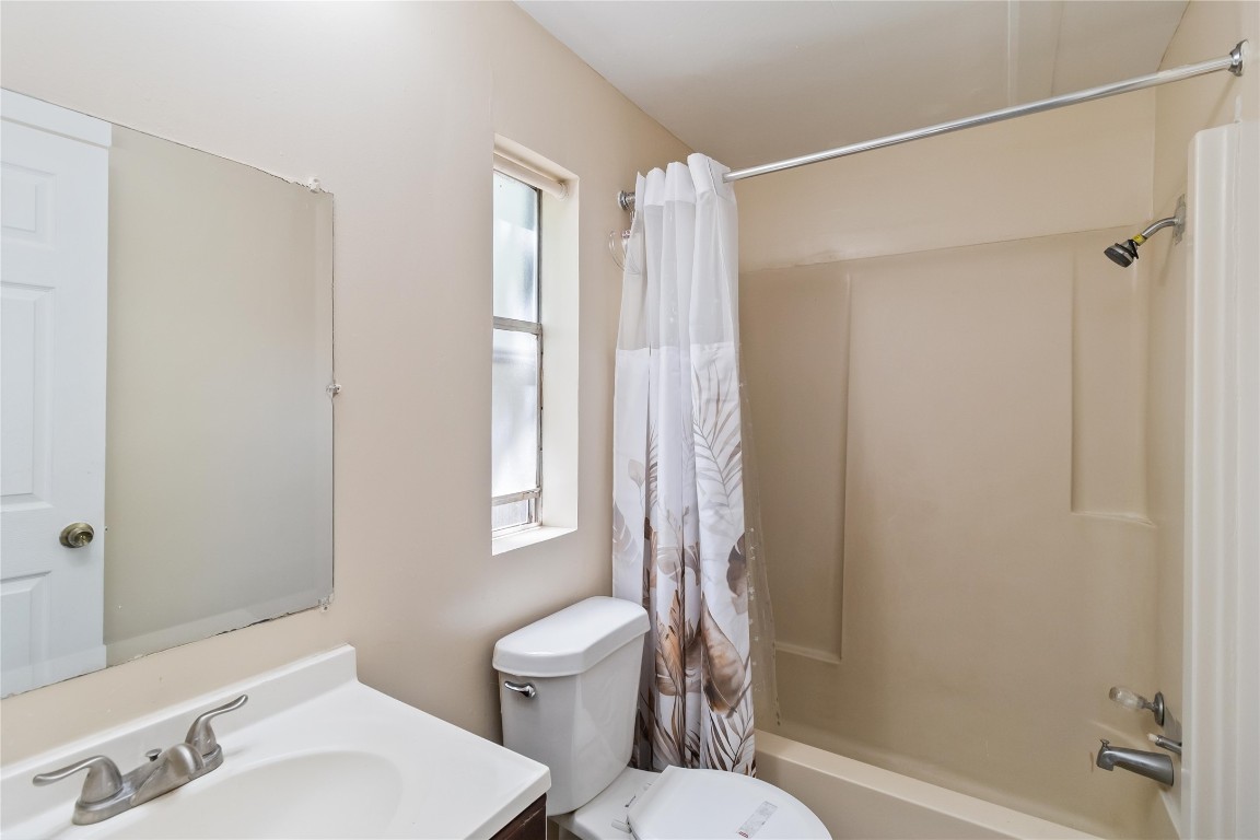 1002 Walter Street Austin, TX 78702 - Photo 17 of 31 a bathroom with a toilet and a shower