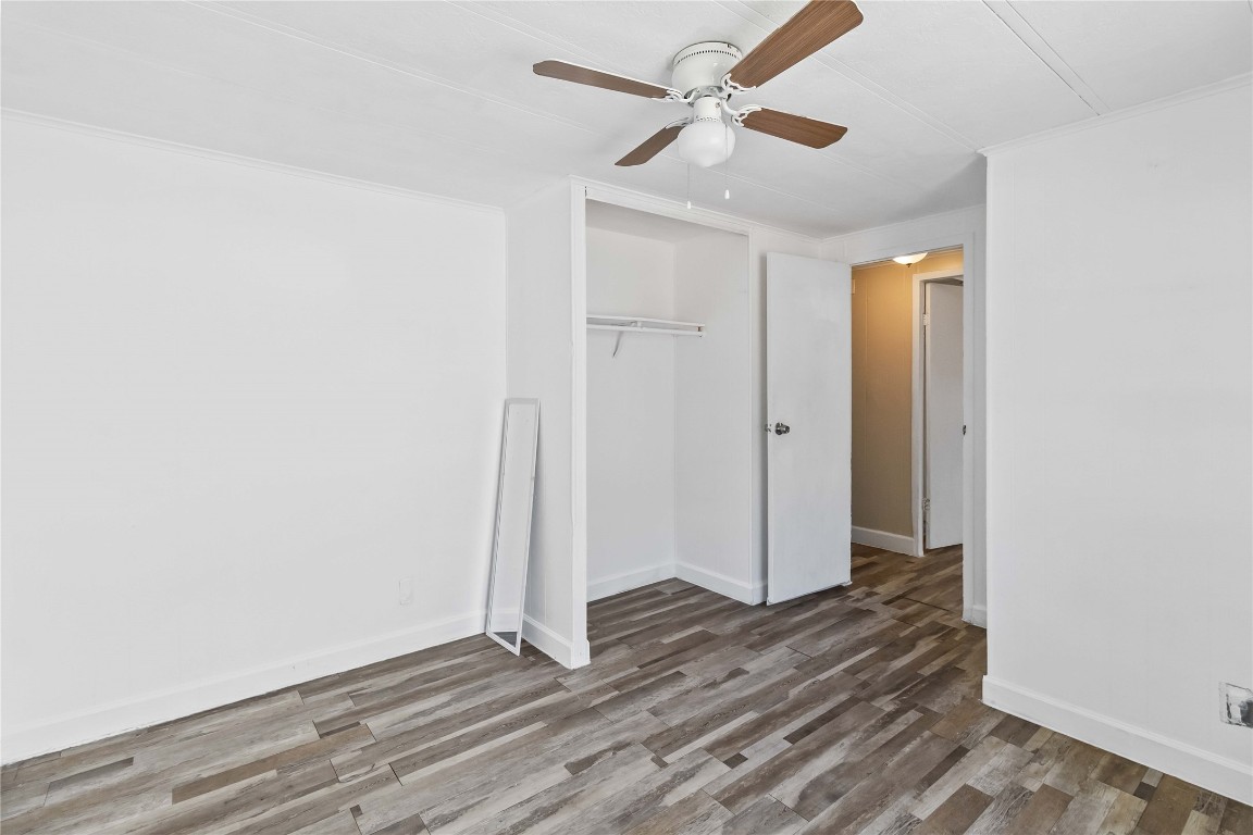 1002 Walter Street Austin, TX 78702 - Photo 19 of 31 an empty room with wooden floor and a ceiling fan
